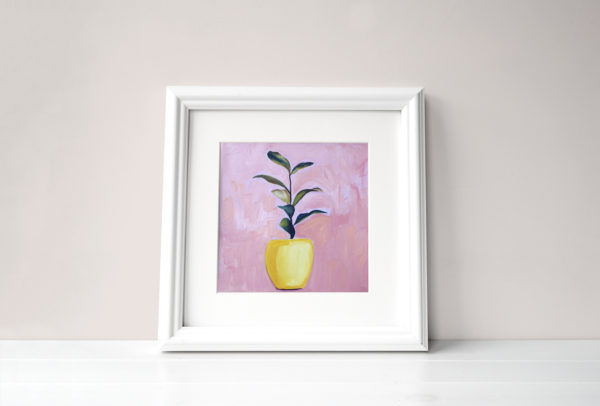 oil painting of a yellow-potted plant on a pink background, in white square frame